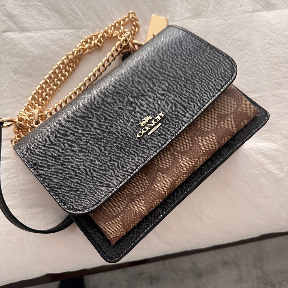 New coach black and tan leather bag can be worn cross body - gold hardware